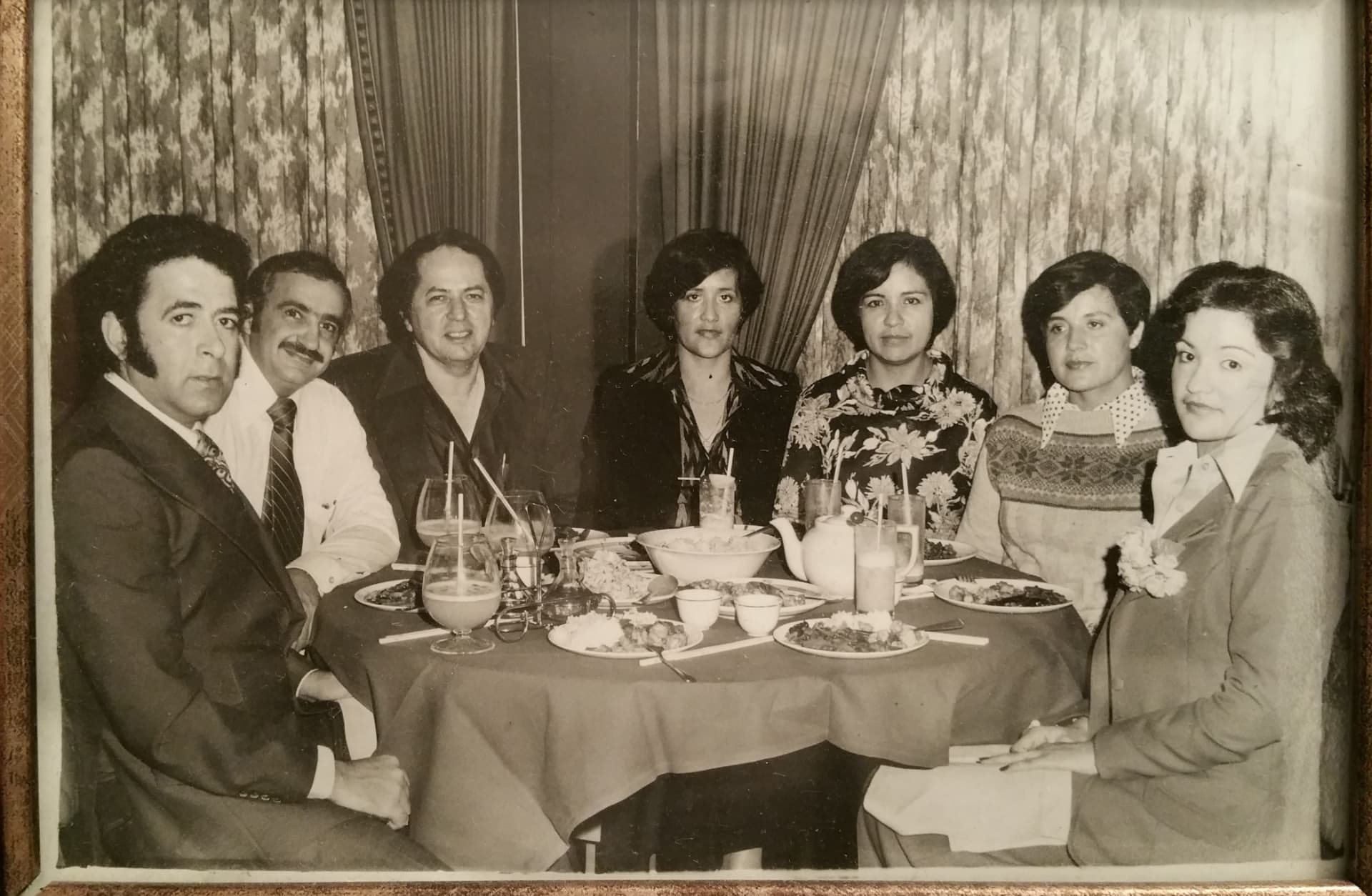 A family sharing traditional Mexican food around the table